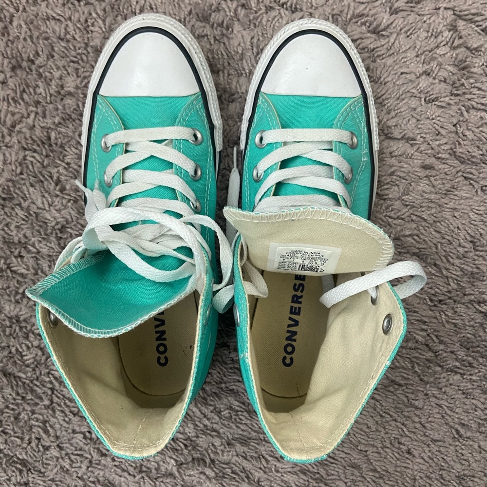 Mint green converse shoes